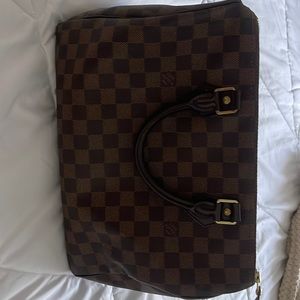 Louis Vuitton bag (it’s the big size)